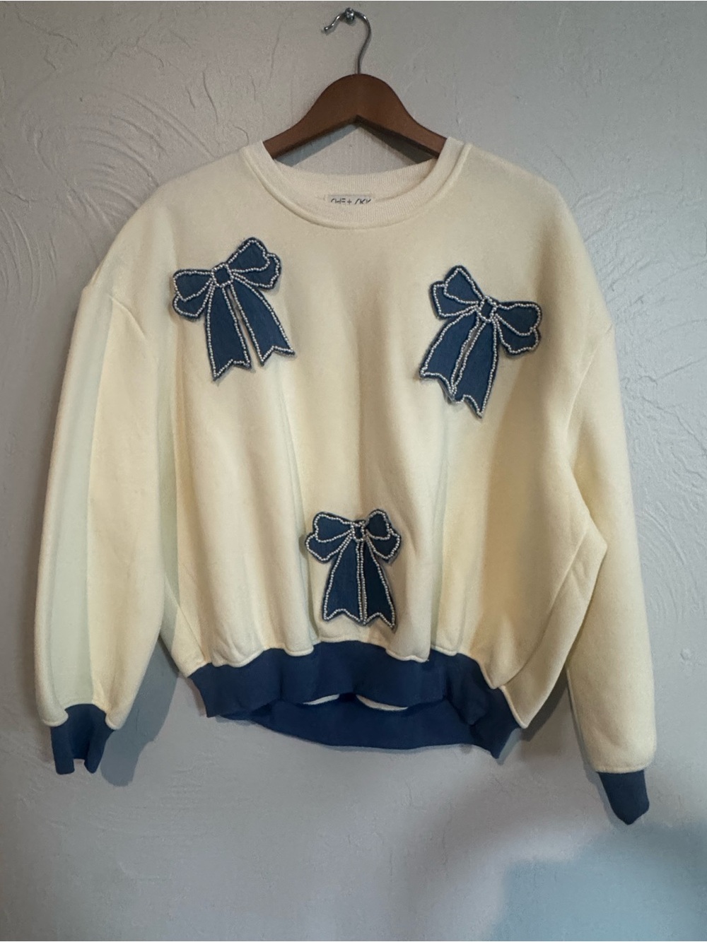 She + Sky Cream Sweater with Blue Bow Appliqués